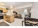 Comfortable living area featuring dining area, tile flooring, a reclining sofa and an open floor plan at 3663 S Sheridan Blvd # 14, Denver, CO 80235