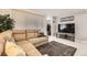 Comfortable living room features tile floors, a reclining sectional sofa, and a view into the hall closet at 3663 S Sheridan Blvd # 14, Denver, CO 80235
