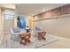 Finished basement with a seating area, exposed brick, and modern decorations at 2088 Kearney St, Denver, CO 80207