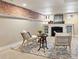 Inviting basement space with a decorative fireplace, neutral paint, and comfortable seating at 2088 Kearney St, Denver, CO 80207