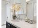 Updated bathroom features white subway tile, modern fixtures, and a sleek vanity at 2088 Kearney St, Denver, CO 80207