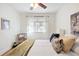 Cozy bedroom with hardwood floors, ceiling fan and white curtains at 2088 Kearney St, Denver, CO 80207