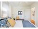 Comfortable bedroom with neutral decor, hardwood floors and ample natural light at 2088 Kearney St, Denver, CO 80207