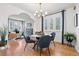 Stylish dining room adjacent to living room, with hardwood floors and contemporary decor at 2088 Kearney St, Denver, CO 80207