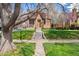 Charming brick home with well-maintained front yard and inviting entryway, creating a warm curb appeal at 2088 Kearney St, Denver, CO 80207