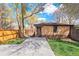 Detached garage with brick exterior, adjacent to private yard at 2088 Kearney St, Denver, CO 80207
