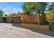 Two-car brick garage with a secure, neutral door and well-maintained landscaping at 2088 Kearney St, Denver, CO 80207