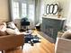 Bright living room showcasing hardwood floors, a fireplace, and modern decor, perfect for entertaining guests at 2088 Kearney St, Denver, CO 80207