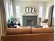 Comfortable living room with a fireplace, hardwood floors, and stylish furnishings for relaxation at 2088 Kearney St, Denver, CO 80207