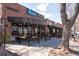 Attractive retail space with inviting outdoor seating, complemented by lush planters and hanging lights at 2088 Kearney St, Denver, CO 80207