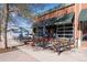 Inviting retail space, 'Cake Crumbs', with outdoor seating and expansive glass doors at 2088 Kearney St, Denver, CO 80207