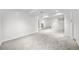 Spacious basement with neutral carpet, white walls, and ample room for various activities at 19398 E Eastman Pl, Aurora, CO 80013