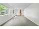 This basement features windows that let in natural light and carpeting at 19398 E Eastman Pl, Aurora, CO 80013