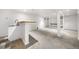 Finished basement featuring neutral carpet, a wet bar, and a column support at 19398 E Eastman Pl, Aurora, CO 80013