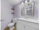 This bathroom features a toilet, sink, vanity, and mirror at 19398 E Eastman Pl, Aurora, CO 80013
