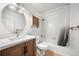 Clean bathroom with a vanity, mirror, and a shower-tub combination at 19398 E Eastman Pl, Aurora, CO 80013