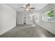 This bedroom features a ceiling fan, closet, and a window that lets in natural light at 19398 E Eastman Pl, Aurora, CO 80013