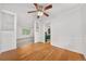 Open-concept dining area showcases beautiful hardwood floors and stylish wainscoting detail at 19398 E Eastman Pl, Aurora, CO 80013