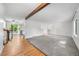 Bright living space with hardwood floors, neutral carpet, and an open layout connecting to the kitchen at 19398 E Eastman Pl, Aurora, CO 80013