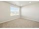 Bedroom filled with natural light has a neutral color palette and comfortable carpet floors at 6132 Hourglass Dr, Brighton, CO 80601