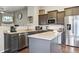 Modern kitchen featuring stainless steel appliances, granite countertops, and a center island at 3469 Amber Sun Cir, Castle Rock, CO 80108