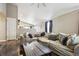 Spacious living room featuring vaulted ceilings, neutral walls, and comfortable sectional seating at 3469 Amber Sun Cir, Castle Rock, CO 80108