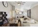 Bright living room boasts hardwood floors, neutral walls, and comfortable sectional seating at 3469 Amber Sun Cir, Castle Rock, CO 80108