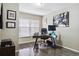 Well-lit home office with a modern desk, comfortable chair, and window with blinds at 3469 Amber Sun Cir, Castle Rock, CO 80108