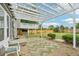 Backyard view of the house featuring a white pergola over a patio at 3932 S Pagosa St, Aurora, CO 80013