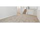 Unfinished basement with neutral carpet and access to stairs at 3932 S Pagosa St, Aurora, CO 80013