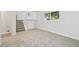 Open basement space with stairs leading to the upper level at 3932 S Pagosa St, Aurora, CO 80013
