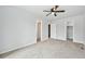Bright bedroom featuring neutral paint, a ceiling fan, and multiple access doors at 3932 S Pagosa St, Aurora, CO 80013