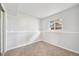 Basement bedroom with neutral colored carpet and trim at 3932 S Pagosa St, Aurora, CO 80013