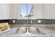 Kitchen sink underneath a window with a view at 3932 S Pagosa St, Aurora, CO 80013