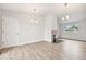 Living room features a fireplace, vinyl floors, and neutral color scheme at 3932 S Pagosa St, Aurora, CO 80013