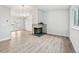 Spacious living room features luxury vinyl flooring and a modern fireplace at 3932 S Pagosa St, Aurora, CO 80013