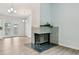 Bright living room showcases vinyl flooring, a fireplace, and backyard access at 3932 S Pagosa St, Aurora, CO 80013