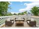 Outdoor patio featuring comfortable seating, a white lattice surround, and views of a neighborhood at 3932 S Pagosa St, Aurora, CO 80013