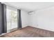 Bright bedroom with a large window and a modern air conditioning unit at 5372 E 108Th Pl, Thornton, CO 80233