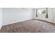 Spacious bedroom with neutral carpet, white walls, a window, and baseboard heating at 5372 E 108Th Pl, Thornton, CO 80233