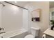 Bright bathroom featuring a tiled shower-tub, modern fixtures, and stylish decor at 65 Avocet Ct, Longmont, CO 80501