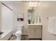 This well-lit bathroom features a modern vanity, shower-tub combo, and contemporary finishes at 65 Avocet Ct, Longmont, CO 80501