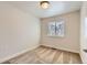 This cozy bedroom features neutral walls, carpet flooring, and a bright window, offering a peaceful retreat at 65 Avocet Ct, Longmont, CO 80501