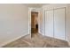 This bedroom offers ample closet space and a welcoming atmosphere, perfect for relaxation and rest at 65 Avocet Ct, Longmont, CO 80501