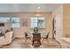 Bright dining area with modern table set, stylish decor, and a view of in-unit laundry at 65 Avocet Ct, Longmont, CO 80501