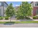 Attractive home with mature trees and well-kept lawn, providing shade and curb appeal at 65 Avocet Ct, Longmont, CO 80501