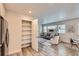 Bright living room area features a modern sofa, plush white chair, and lots of natural light at 65 Avocet Ct, Longmont, CO 80501
