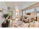Comfortable living room with plush seating, neutral tones, and ample natural light, ideal for relaxation at 65 Avocet Ct, Longmont, CO 80501