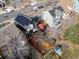 Birds-eye view of the home with solar panels, backyard shed and raised back deck at 795 Nighthawk Cir, Louisville, CO 80027