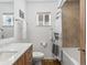 Bathroom featuring a shower over the bath and a vanity unit at 795 Nighthawk Cir, Louisville, CO 80027